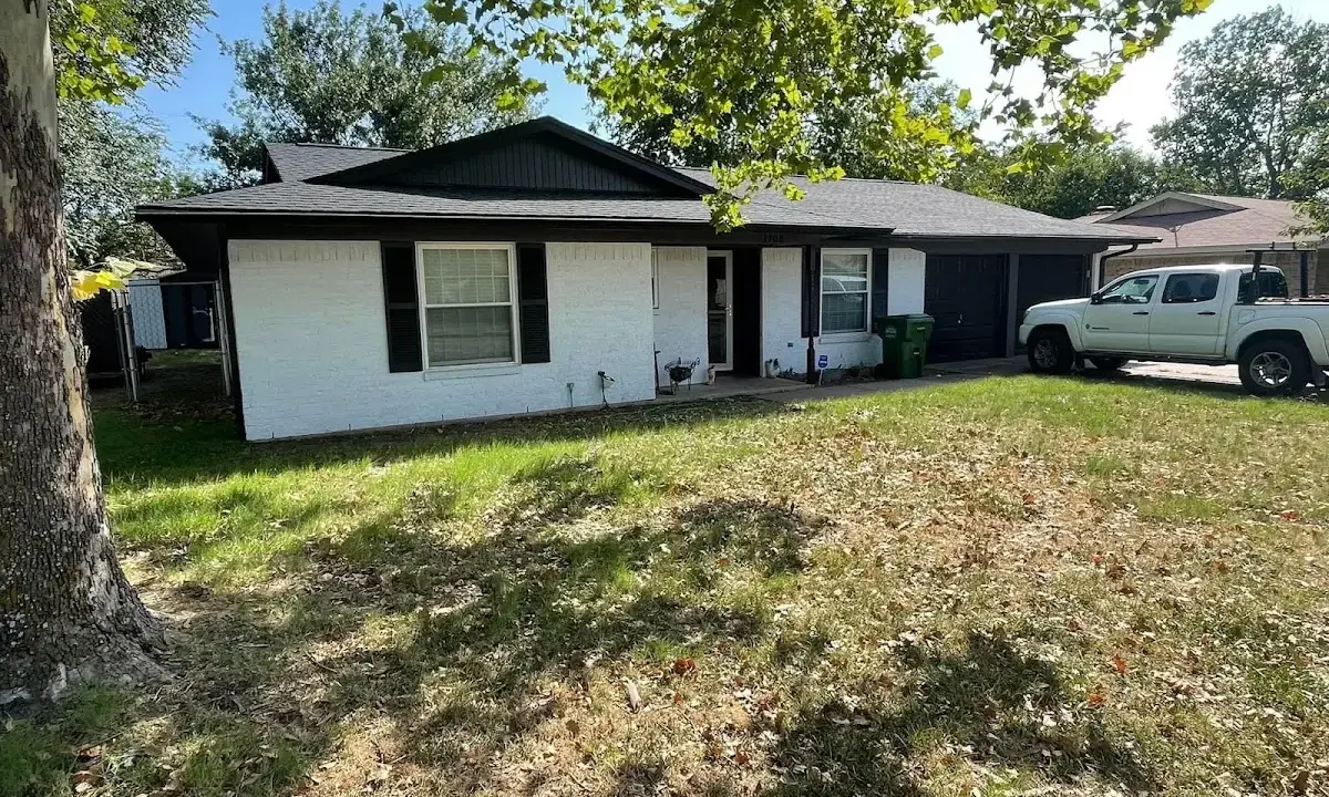 Professional roofing crew working on a residential roof in Greensburg